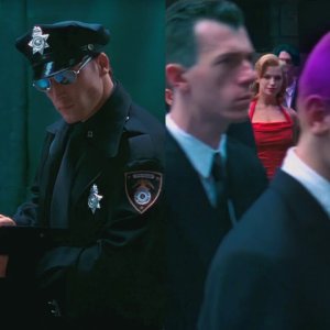 The dude in the red dress.